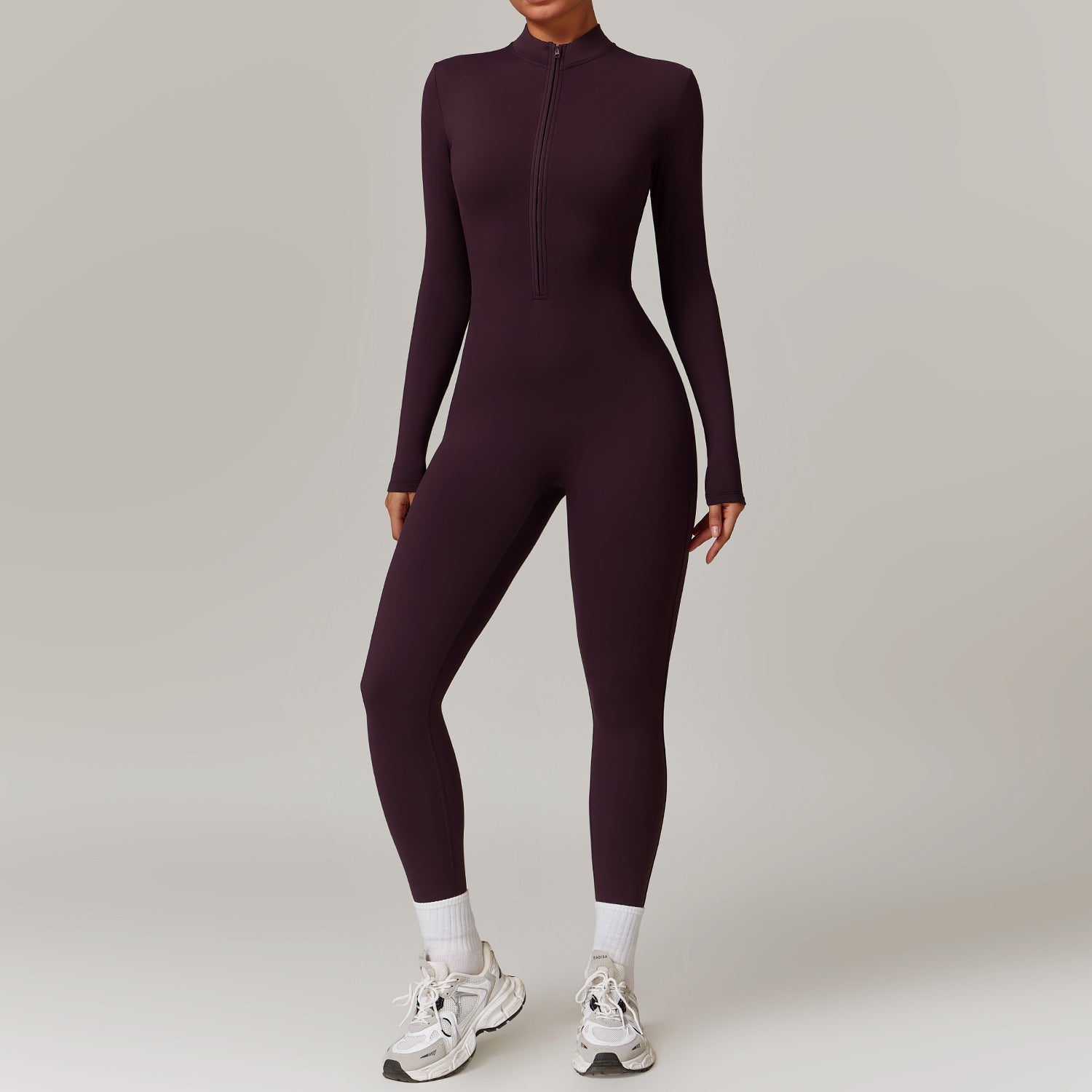 Warm zip-up long-sleeve yoga jumpsuit for women.