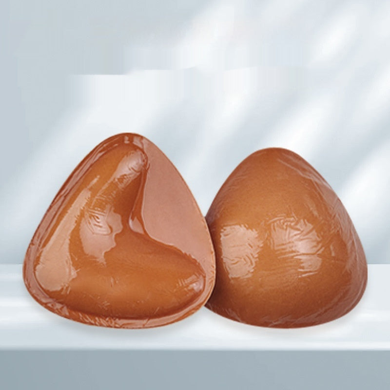 Double-sided adhesive bra inserts for push-up and breast lift.